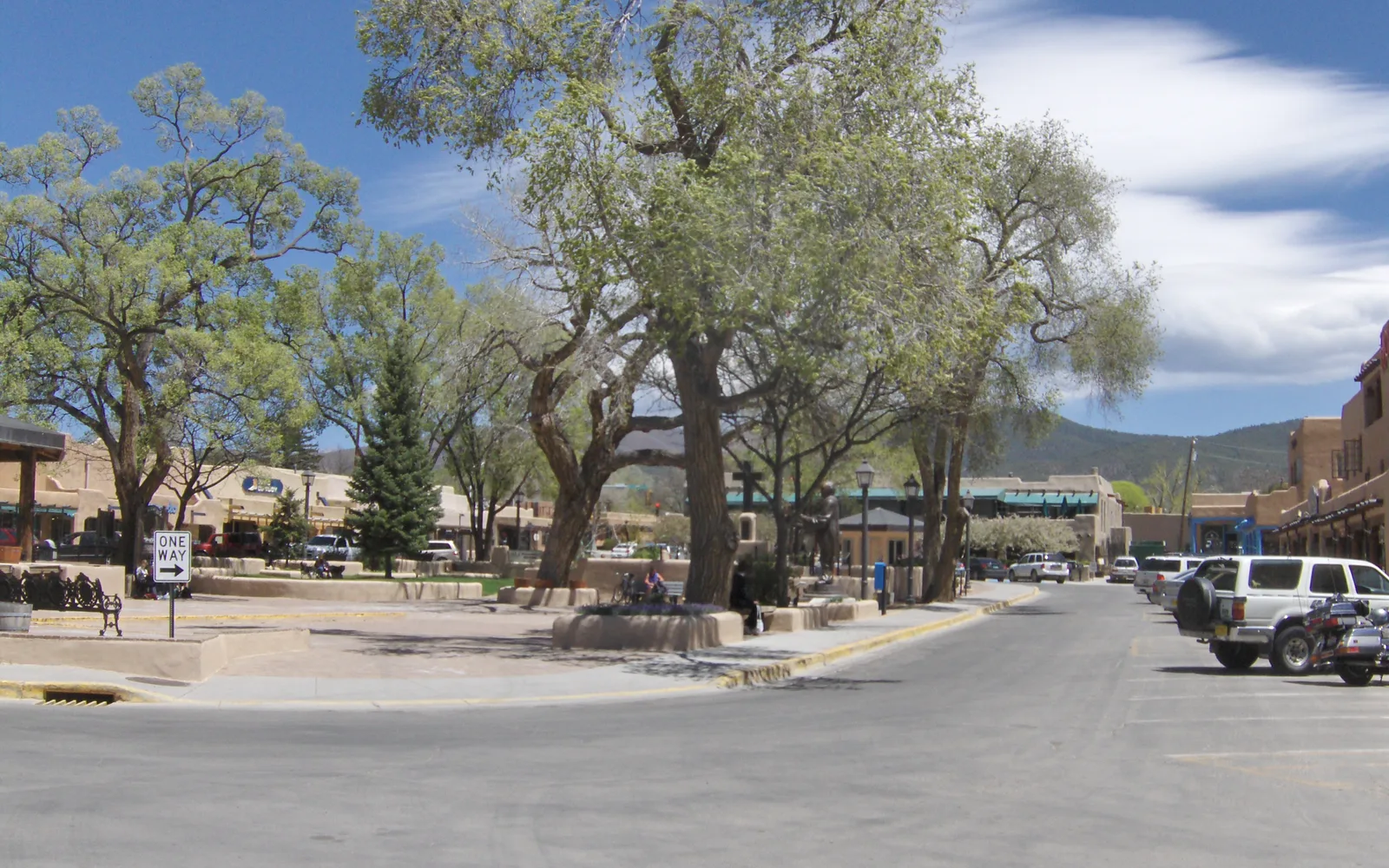 Historic downtown plaza with period buildings and community gathering space