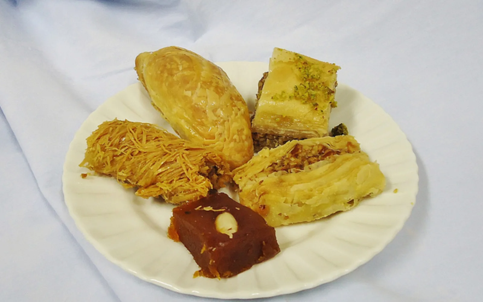 Middle Eastern sweets and pastries displayed at a market